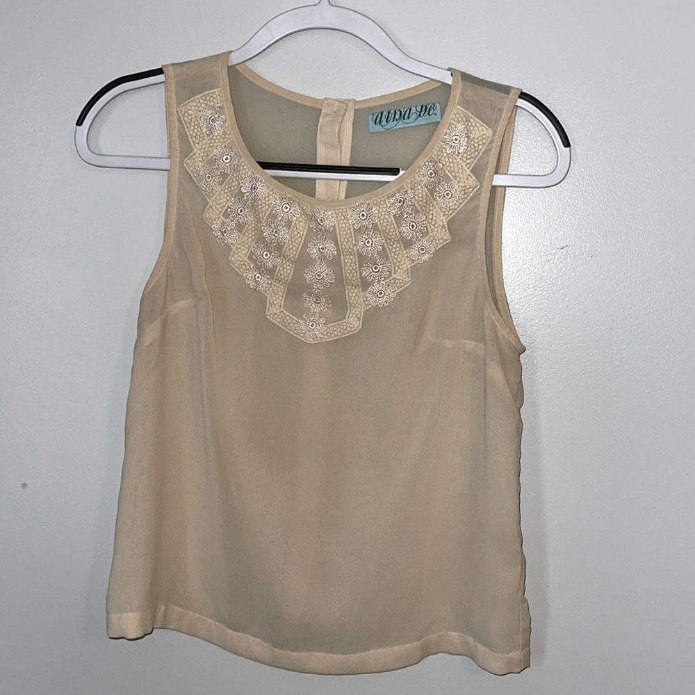 Cute work blouse with button detail down the back